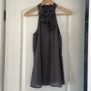 High-neck grey top with floral details